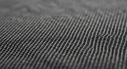 Close-up macro shot of a textured fabric with fine parallel lines creating a subtle visual pattern