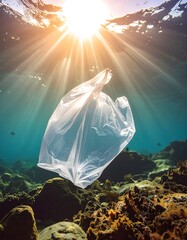 Plastic bag pollution underwater. Sunlight streams through water