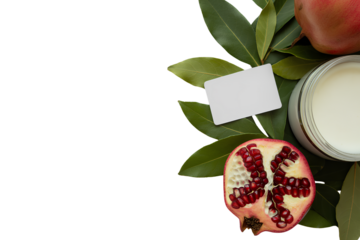 Pomegranate half jar of cream and blank card with leaves isolated on a transparent background