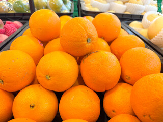 Fresh Ripe Oranges Pile in Market Display