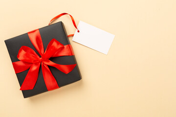 Black gift boxes on color background, top view. Black Friday concept