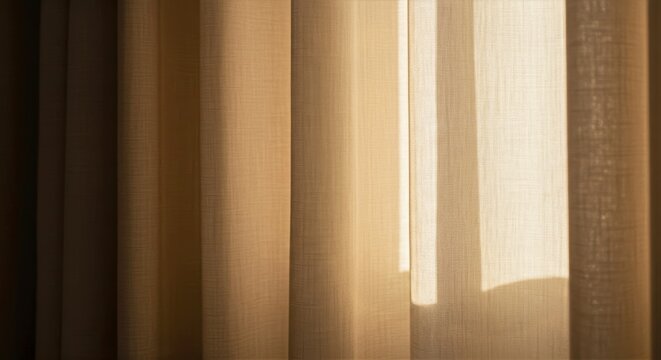 Warm morning sunlight dances across thick beige curtains with soft shadows and subtle sheen
