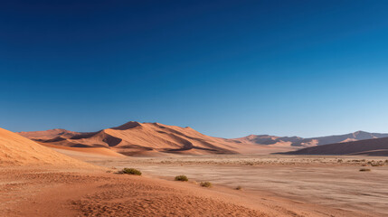 Naklejka premium experience breathtaking beauty of namib desert sand dunes in namibia where golden hues contrast against deep blue