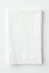 Fototapeta premium A crisp white folded cotton flat sheet or tablecloth with a sateen border, viewed from above on a clean background for a minimalist aesthetic