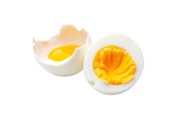 Deliciously prepared hard-boiled egg halved revealing yolk and white on a deep black background transparent background