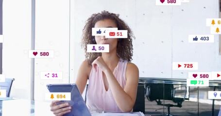 Female presenter tapping tablet in office spawning animated social media metrics rising steadily - Powered by Adobe