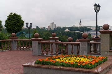  Vitebsk, Belarus, July 19, 2025. Flowerbed in front of the staircase railing.                              