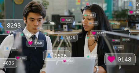 Woman pointing at laptop causing colleagues reviewing floating social media metrics rising - Powered by Adobe