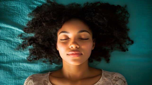 Serene Young Woman Sleeping Peacefully on Teal Bedding