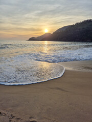 Beautiful pink sunset on a paradisiacal beach