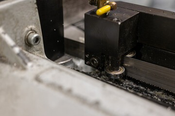 Close-up of a guide bearing on a bandsaw.
