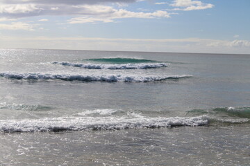 waves  on a bright sunny day beach