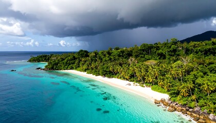 Aerial view of tropical island with white sand beach turquoise water lush green jungle and dark storm clouds