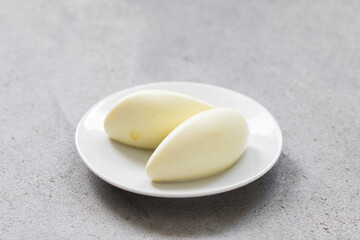 Lemon cream dessert quenelle, on a plate. Close up	