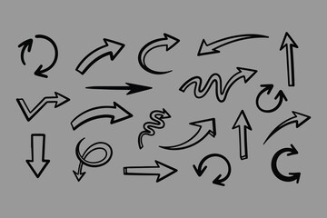 A collection of hand drawn arrows in various styles and directions featuring curved straight and zigzag designs on a neutral background