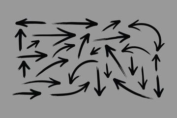 A collection of hand drawn arrows in various directions and styles on a solid gray background representing direction and movement