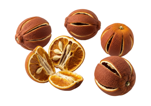 Three to five shriveled dried bitter oranges with russet and ochre tones, one broken revealing dry segments, on a transparent studio background. Concept of natural decay and time's passage