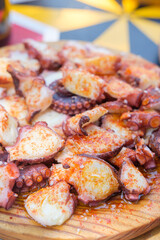 Authentic Flavor of Spain with a classic octopus tapa on a wooden board