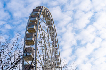 Ferris wheel with blue cloudy sky in the background in Hungary