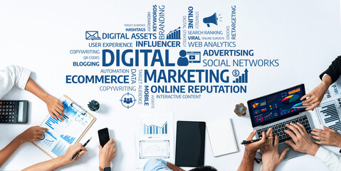 Professionals engaged in a digital marketing strategy session, utilizing technology and...