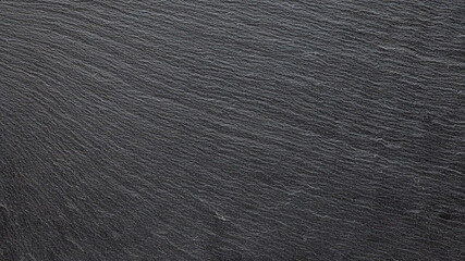 Black slate presents rugged texture, making a striking background for graphic design, product photography, or branding.