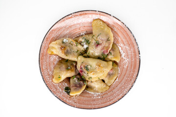 dumplings with cherries on a plate