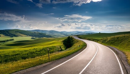 Fototapeta premium winding asphalt road through rural landscape