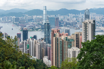 View of Hong Kong and Kowloon from Victoria peak. Panorama of Hong Kong, skyscrapers and nature.