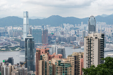 Fototapeta premium View of Hong Kong and Kowloon from Victoria peak. Panorama of Hong Kong, skyscrapers and nature.