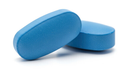 Two blue oval pharmaceutical pills isolated against a clean white background for healthcare concepts