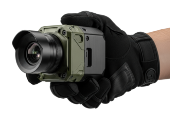 Strong hand in dark tactical glove firmly grasping cutting-edge multi-spectral surveillance camera with large optical lens, isolated on transparent, concept of tactical technology