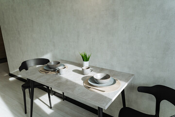 Experience a Modern Minimalist Dining Setup featuring Elegant Tableware, perfectly arranged in a Bright, airy Space that enhances the overall aesthetic and dining experience