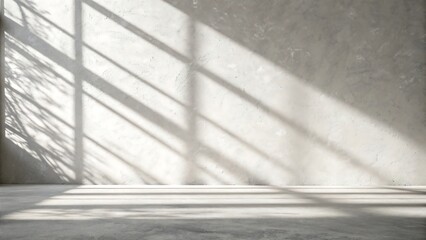 Sunlight streaming through a window casting dramatic diagonal shadows on a textured wall and floor