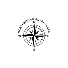 A black and white compass rose logo symbolizing adventure and exploration.