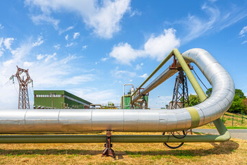 Geothermal energy. Pipelines of a plant at sunset in Larderello, Tuscany region, Italy