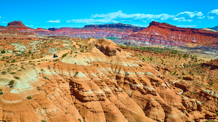 Aerial Desert Road and Vibrant Sandstone Hills in Paria Utah Wilderness