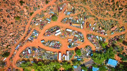 Aerial Junkyard and Abandoned Vehicles in Desert Landscape Utah