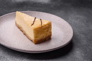 A piece of sweet New York cheesecake, dessert, cheese and vanilla pie. Classic cheesecake