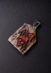 Craft home made chocolate with berries and fruits, delicious sweets. Craft chocolate