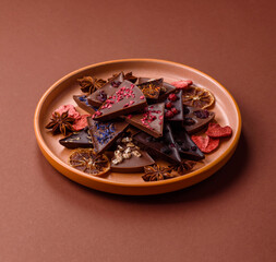 Craft home made chocolate with berries and fruits, delicious sweets. Craft chocolate