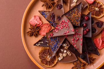 Craft home made chocolate with berries and fruits, delicious sweets. Craft chocolate