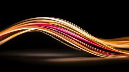 Dynamic abstract design featuring flowing, vibrant ribbons of gold, orange, and pink hues against a striking black background.