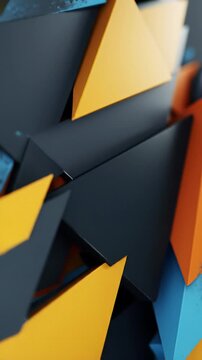 A dynamic abstract motion background video with sharp, angular geometric shapes (triangles, parallelograms) in vibrant orange, yellow, charcoal, blue, sliding and interlocking seamlessly with fluid