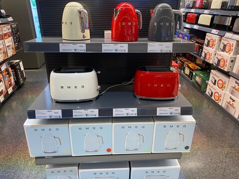 Palma De Mallorca, Spain - August 25, 2025: Smeg kitchen appliances displayed on shelves, featuring stylish toasters and kettles in various colors, showcasing modern design and functionality
