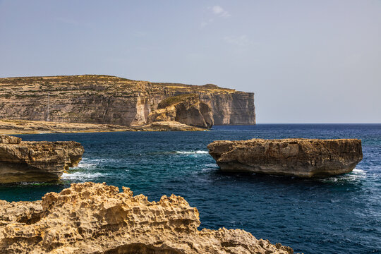 Rocky coastline and clear sea waters of Gozo, Malta.