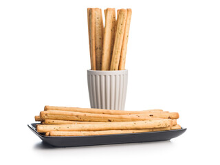 Crispy grissini breadsticks isolated on white background.