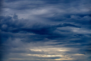 Dramatic cloudscape with glimpses of ligh in sky