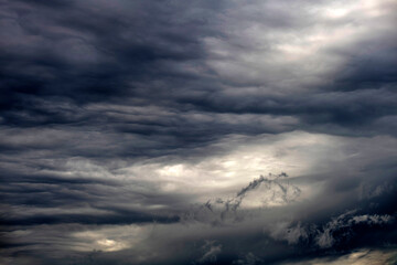 Dramatic cloudscape with glimpses of ligh in sky