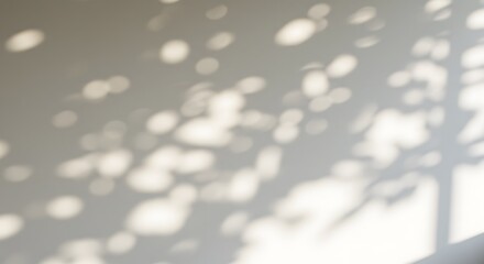 Gentle dappled sunlight patterns from leaves cast soft shadows on a clean textured wall creating a peaceful and tranquil atmosphere with natural light	