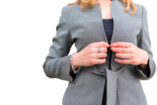 Confident businesswoman adjusting her elegant gray coat in transparent background png. Leadership, empowerment, modern professional style, corporate, business, work, confidence, office, manager